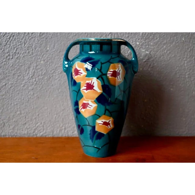 This large vase is a production of the Keller & Guérin earthenware factory in Lunéville in the 1920s. It is decorated with...