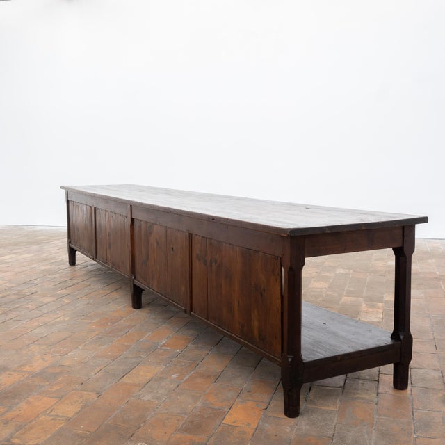 Large early 20th-century fir draper's table. Long solid wood top. One drawer in the front apron. Large lower shelf running...