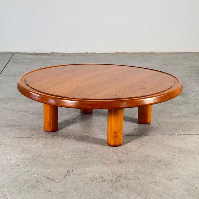 Rare round coffee or sofa table in solid stained pine, produced in France during the late 1960s. The design captures the...