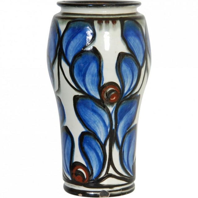 Herman Kähler ceramic vase with blue floral motif from the 1920s–1930s. The vase has multiple chips. Height: 27.5 cm,...