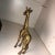 Hand crafted textured brass giraffe. Made in Taiwan. Stands 8” tall, 5” long and 1.25” wide.