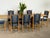 This oak trestle dining table is executed in the manner of Henning Kjærnulf, likely produced in Denmark during the 1960s....