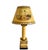 A pair of golden yellow tole table lamps with black stenciling and a decoupage image of ancient ruins on the custom...