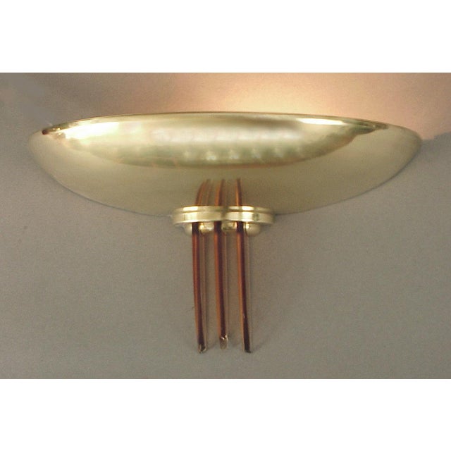 Solid brass, each with three peach glass "wings" descending. Each sconce measures 12 inches across and projects about 6...