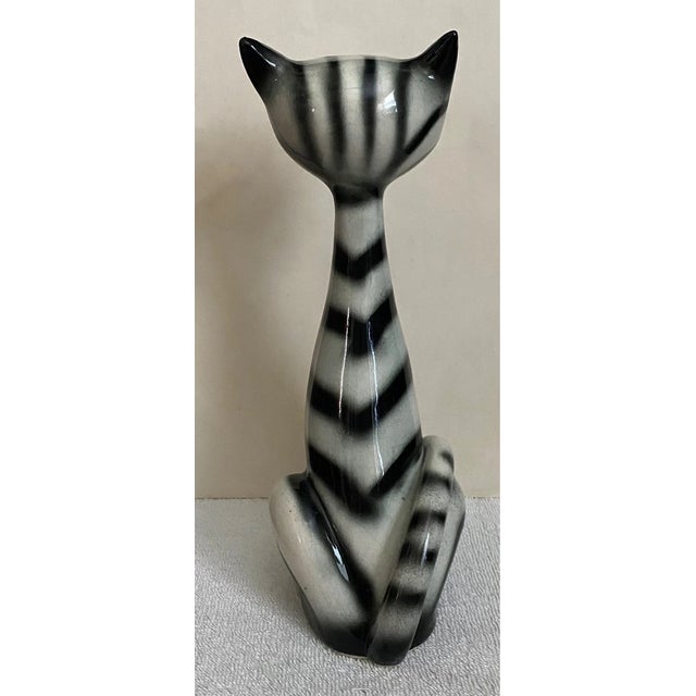 Add a touch of whimsical vintage charm to your collection with this **Vintage Lipper & Mann Long Neck Black & White...