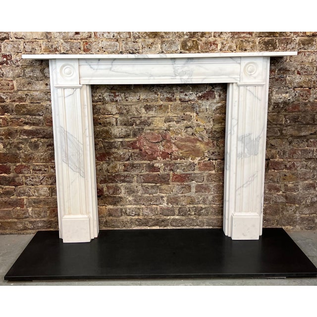 MISSING TOP MANTLE PIECE! A stunning example of timeless craftsmanship, this 19th Century Carrara Marble Fireplace...
