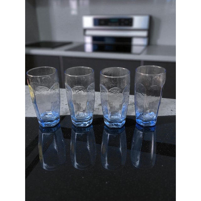 This vintage set of four Libbey Chivalry blue glass tumblers exudes a mid-century modern style, perfect for all occasions....