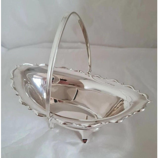 A fine antique english sterling silver swing-handle basket by the renowned sheffield maker joseph rodgers & sons,...