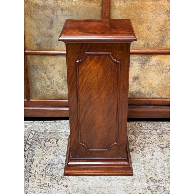 Design Plus Gallery presents a Figured Mahogany Pedestal Stand. The auburn tone of the wooden stand is swirled to give it...