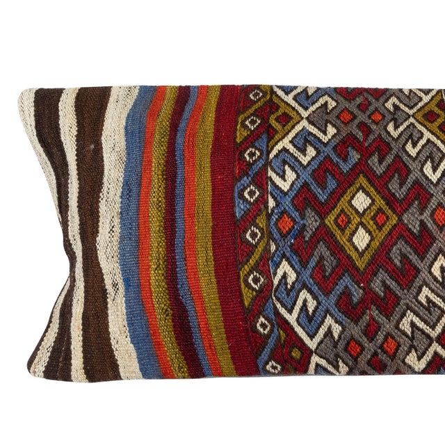 Add a touch of history and warmth to your space with this vintage handmade Turkish wool kilim cushion cover. Crafted from...