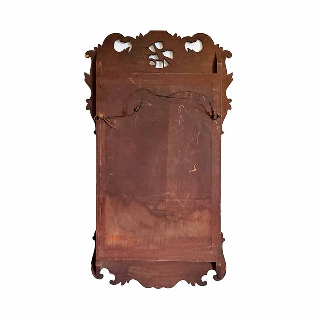 Antique 19th century wall mirror with the classical central ho-ho bird and a gilt slip.
