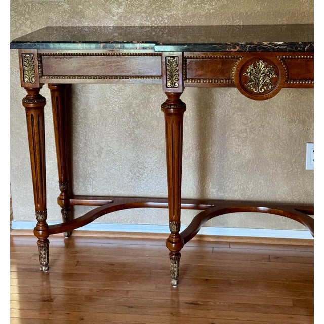 French Louis VXI inspired Henredon Marble top Console, Elegant fluted column legs, curvaceous lower stretcher, Gilt metal...