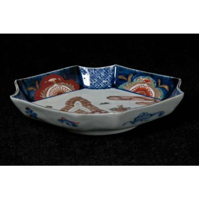 Hand decorated in traditional vibrant colors, interesting diamond shape.