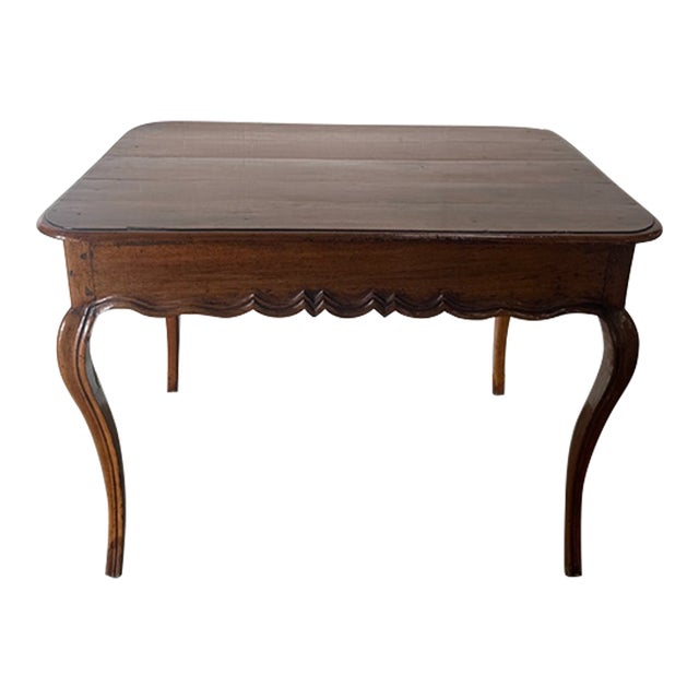 Early Louis XV French lowboy (sidetable). ca. 1765 Beautiful refined, light fruitwood Carved apron Cabriole legs One...