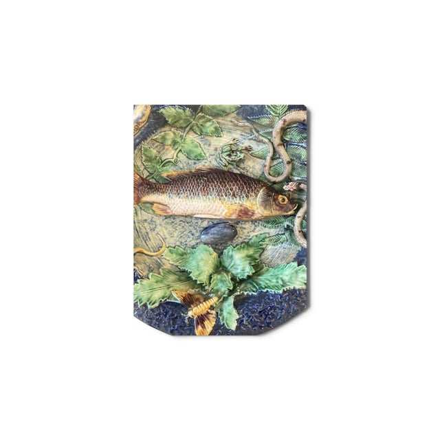 An exceptional and highly detailed 19th-century French Palissy Ware majolica charger, capturing a vivid trompe-l'œil...