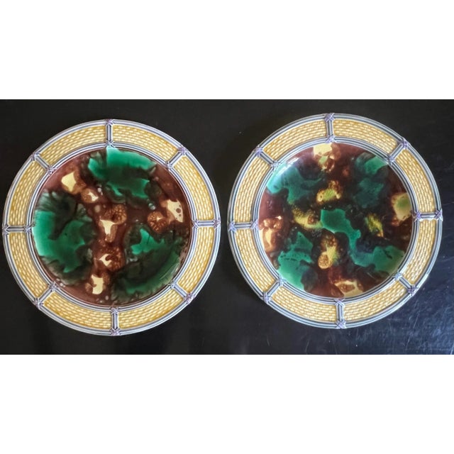 Wedgwood majolica antique plate decorated with a yellow basketweave rim with a tortoise shell style center. Each plate is...