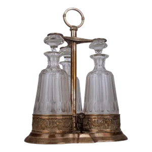 Jugendstil/Art Nouveau Set of Silver Tantalus and Three Glass Decanters With Stoppers by German Company Württembergische Metallwarenfabrik (Wmf)