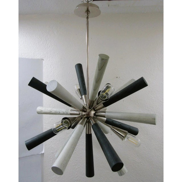 Elk Home Solara Polished Nickel Metal 6 Light Chandelier Sputnik Design The solid turned wood spindles that radiate...
