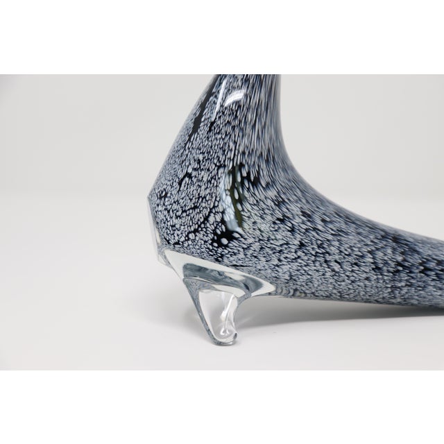 Murano glass sculptures are renowned for their exquisite craftsmanship and beauty, and this is an elegant piece. This...