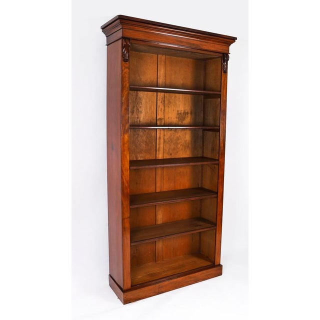 An antique Victorian mahogany free-standing open bookcase, circa 1870 in date It has five adjustable shelves, which are...