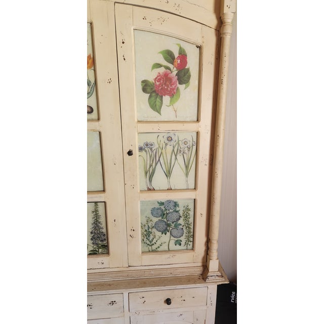 Massive two-piece distressed Antique White French Country style China Cupboard Hutch with Shelves and Drawers. The upper...