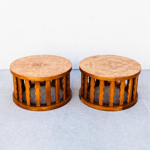 A pair of walnut and olive ash burl cylindrical side tables by Cal Mode, made in Culver City, CA in the 1960s. The top...