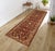 Enhance the ambiance of your home with this magnificent Persian-influenced Turkish hand-knotted rug made by skilled...