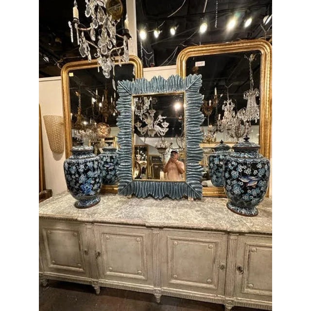 Decorative modern silvery blue Murano glass mirror. Creates and beautiful textural look. A favorite of top designers.