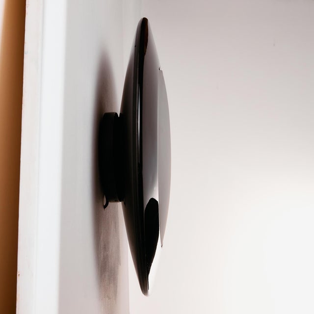 An exciting postmodern style piece with interesting details. The ceiling lamp has beautifully rounded, curved shapes and a...