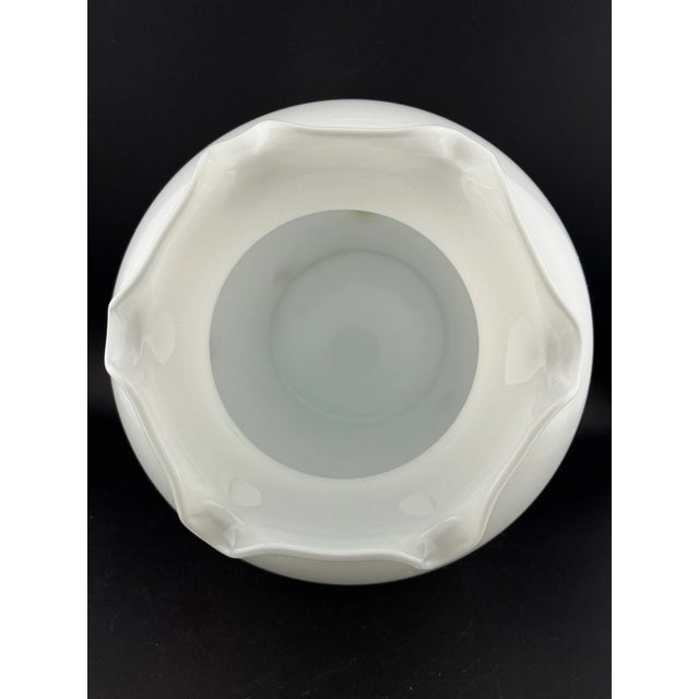 This decorative piece reflects the traditional Italian Lavorazione glassmaking technique, known for its intricate floral...