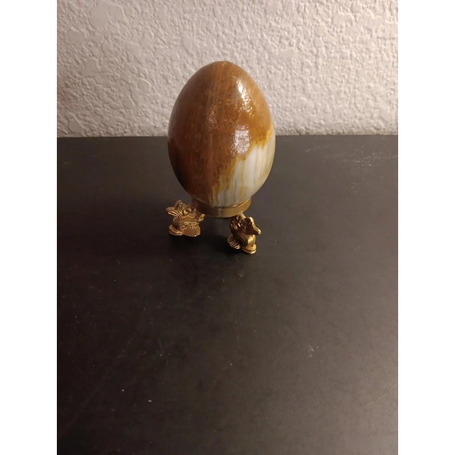 GORGEOUS Variegated Marble 3" Egg Figurine on Miniature Brass Figural Pedestal. This stunning 3" egg figurine, resting on...