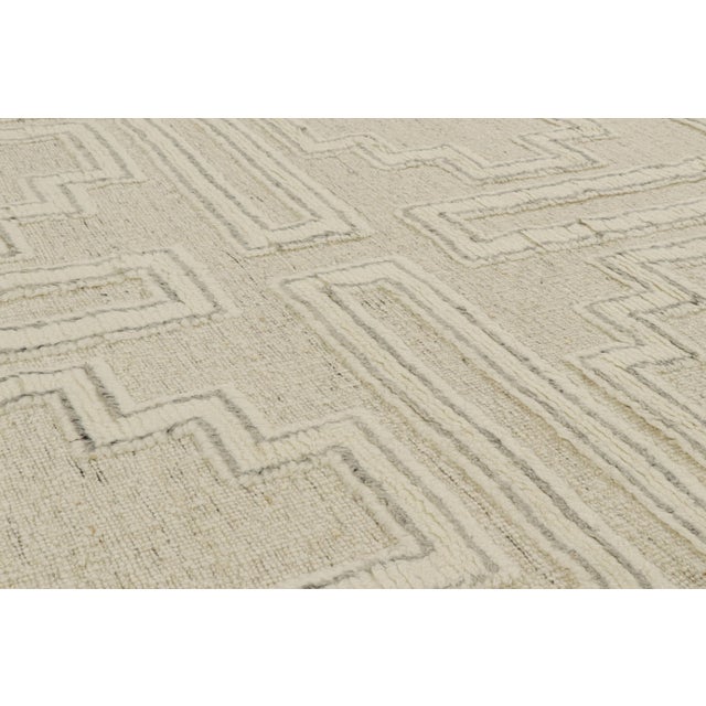 Hand-knotted in wool, this 8x10 smart work both contemporary and textural from India, features variations in color and...