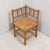 Mid-20th century Dutch corner chair with bobbin-turned oak frame and handwoven rush seat. The compact, space-saving form...