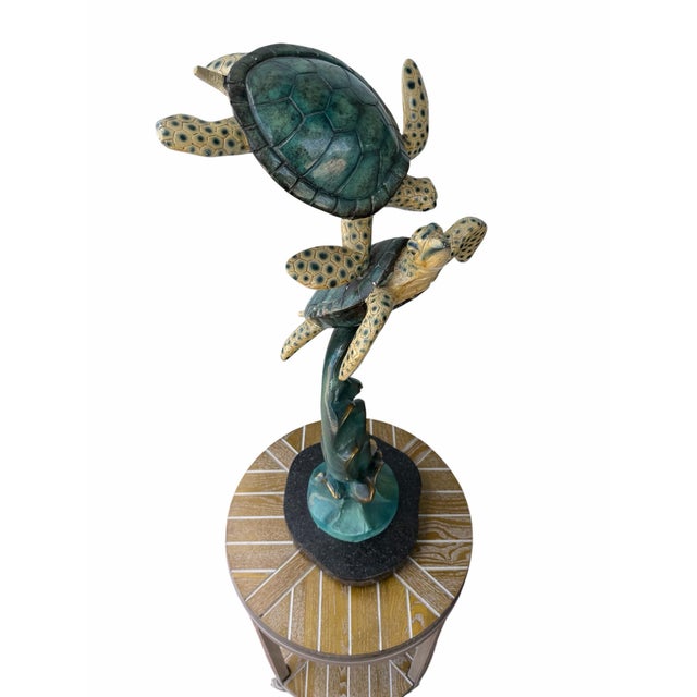 Bring the serene motion of the ocean into your space with this exquisitely cast solid bronze marine sculpture titled...