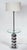 1960s Mod floor lamp with the practical addition of a circular glass table affixed midway up the pole Base is comprised of...