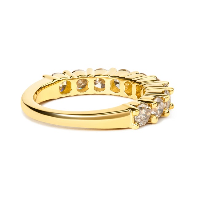 This modern twist on a classic anniversary band ring features shining 14k yellow gold plated .925 sterling silver and 10...