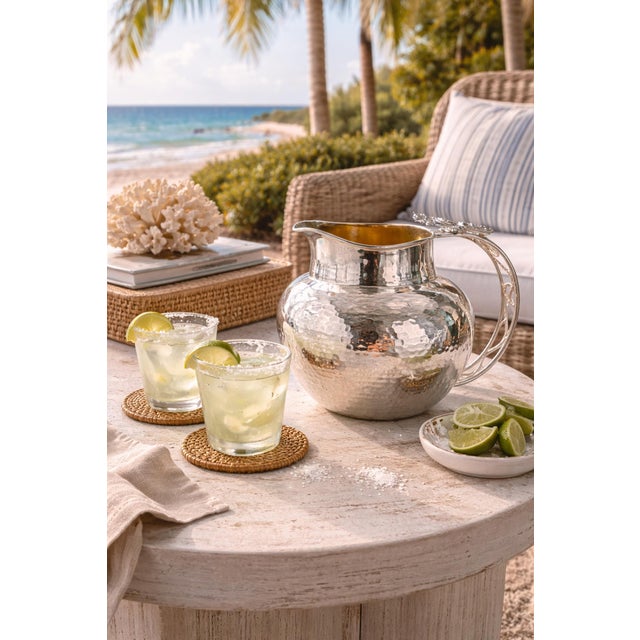 Striking and sculptural vintage water pitcher designed and handcrafted in Taxco, Mexico by renowned Mexican silversmith...