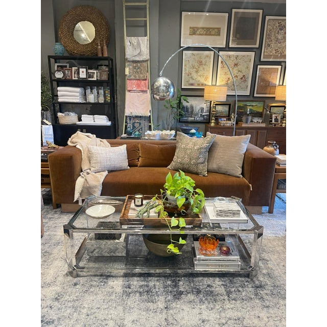 Custom-made sofa upholstered in copper tone Romo velvet with a lush pile and subtle striation. Features a burl plinth and...