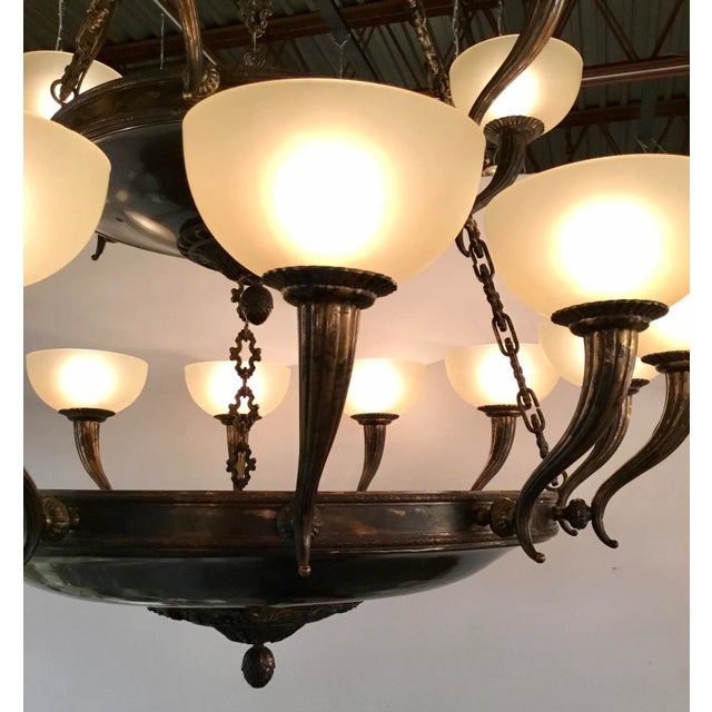 Original Retail $18,152, elegant Myran Allan Luxury Lighting Empire Style Bronze and Glass Chandelier, two tiered over...