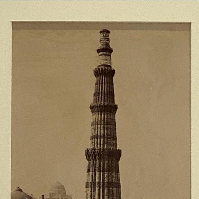 A 19th-century silver albumen photograph of the Quatab Minar (also spelled Qutb Minar or Qutub Minar) in Delhi, India.