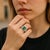 Indulge in timeless elegance with this exquisite cocktail ring, featuring a stunning emerald-shaped emerald weighing 0.75...