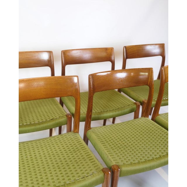 Six dining chairs designed by Niels O. Møller in the 1960s. Model 77 is made of teak with seats in green paper wicker. The...