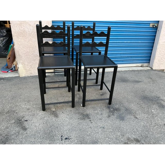 Set of country French solid oak counter stools. Stools are done in a rich satin/ebony finish. . The stools were custom...