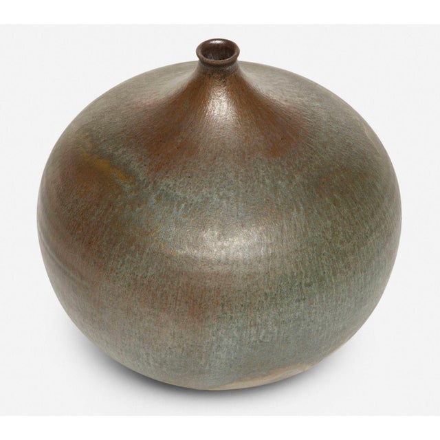 Gertrud and Otto Natzler Round Bottle with Lip, 1967 Earthenware with a special Steel Blue matte glaze, showing subtle...