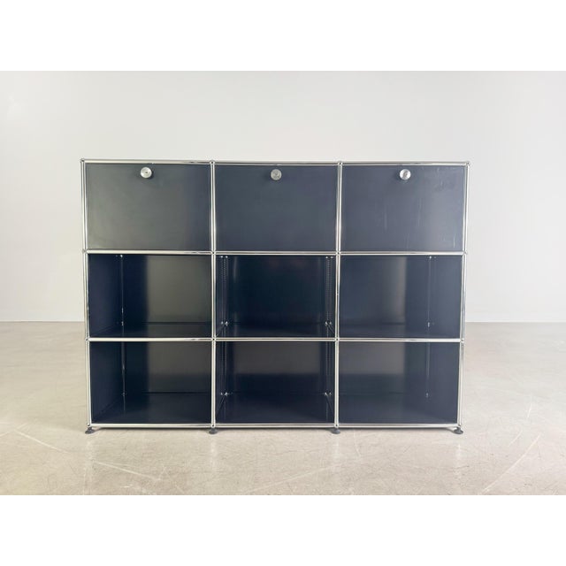 We are offering a beautiful black USM Haller shelving unit/sideboard for sale. The unit is three modular units high and...