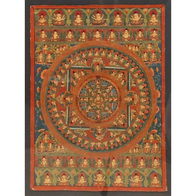 Framed hand painted Tibetan Buddhist mandala Thangka/ Paubha (painting on cloth), depicting various bodhisattvas and...