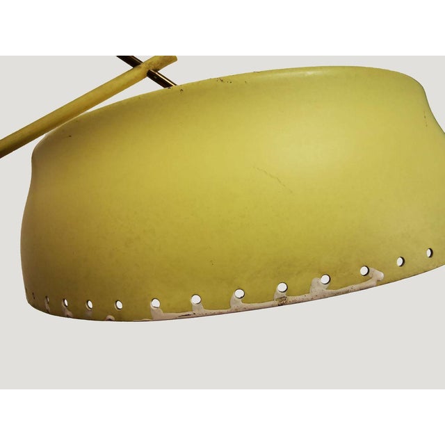 This Arredoluce yellow lamp is an original lamp designed by Angelo Lelli and manufactured by Arredoluce very likely in...