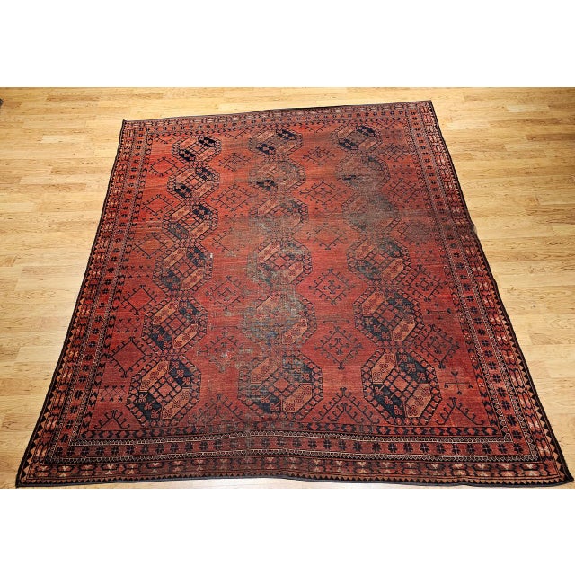 A striking late 19th century Turkmen Ersari rug, handwoven in a rare near-square room-size format. This vintage tribal...