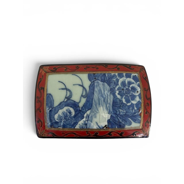 Beautifully crafted Chinese trinket or jewelry box. Features a vibrant cinnabar-red and black lacquered wood body adorned...