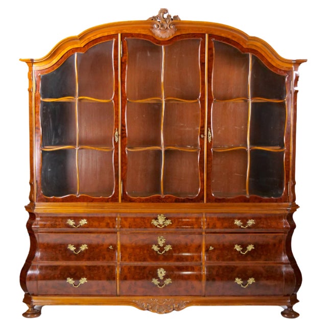 Discover a truly exceptional and generously sized two part vitrine / display cabinet, expertly crafted in the opulent...